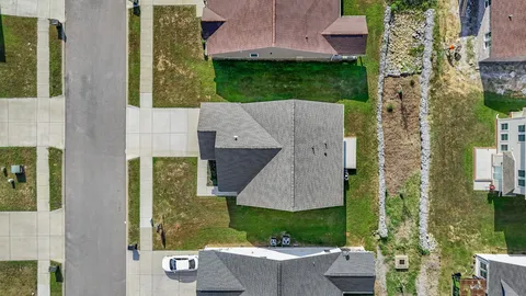 aerial view of a house with a garden and plants