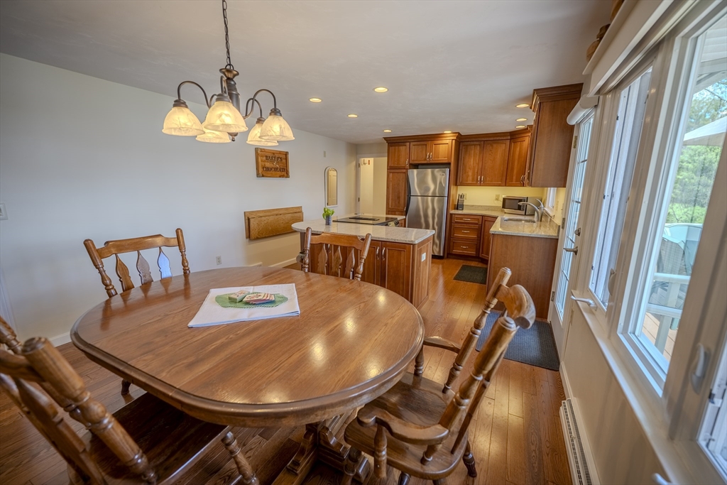 132 Paxton Road Spencer, MA 01562 - Photo 14 of 42 a view of a dining room with furniture window and outside view