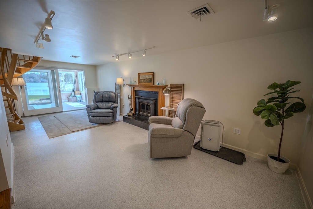 132 Paxton Road Spencer, MA 01562 - Photo 23 of 42 a living room with furniture and a potted plant