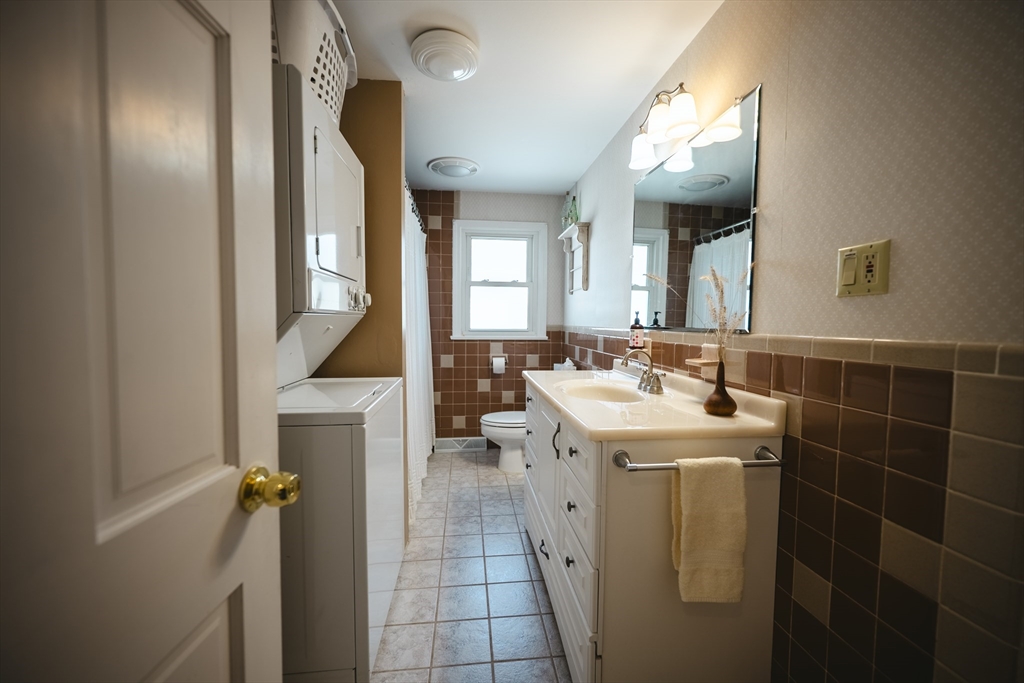 132 Paxton Road Spencer, MA 01562 - Photo 31 of 42 a bathroom with a sink and a mirror