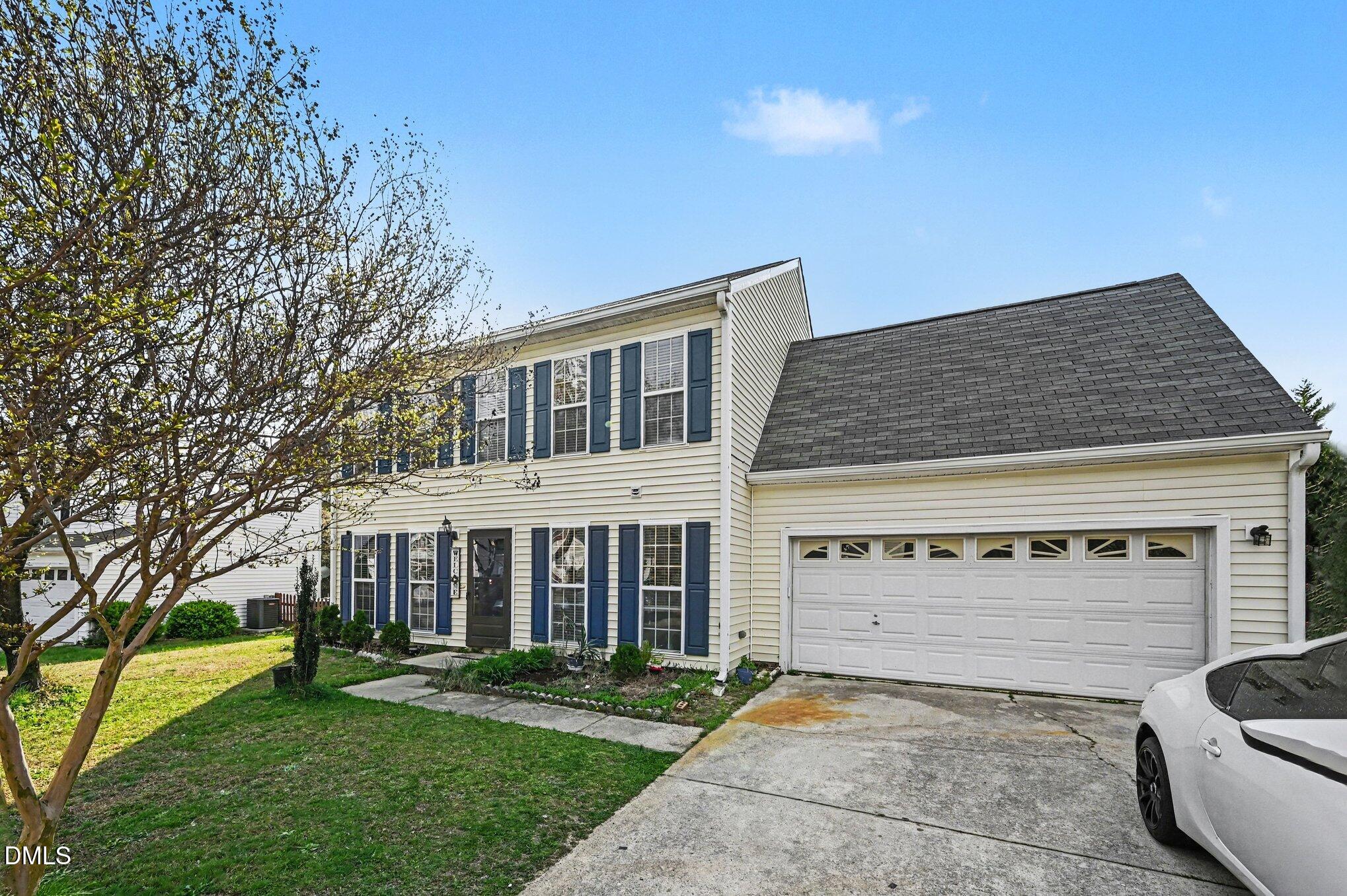 5115 Cardinal Grove Boulevard Raleigh, NC 27616 - Photo 25 of 36 a view of a house with a yard and plants