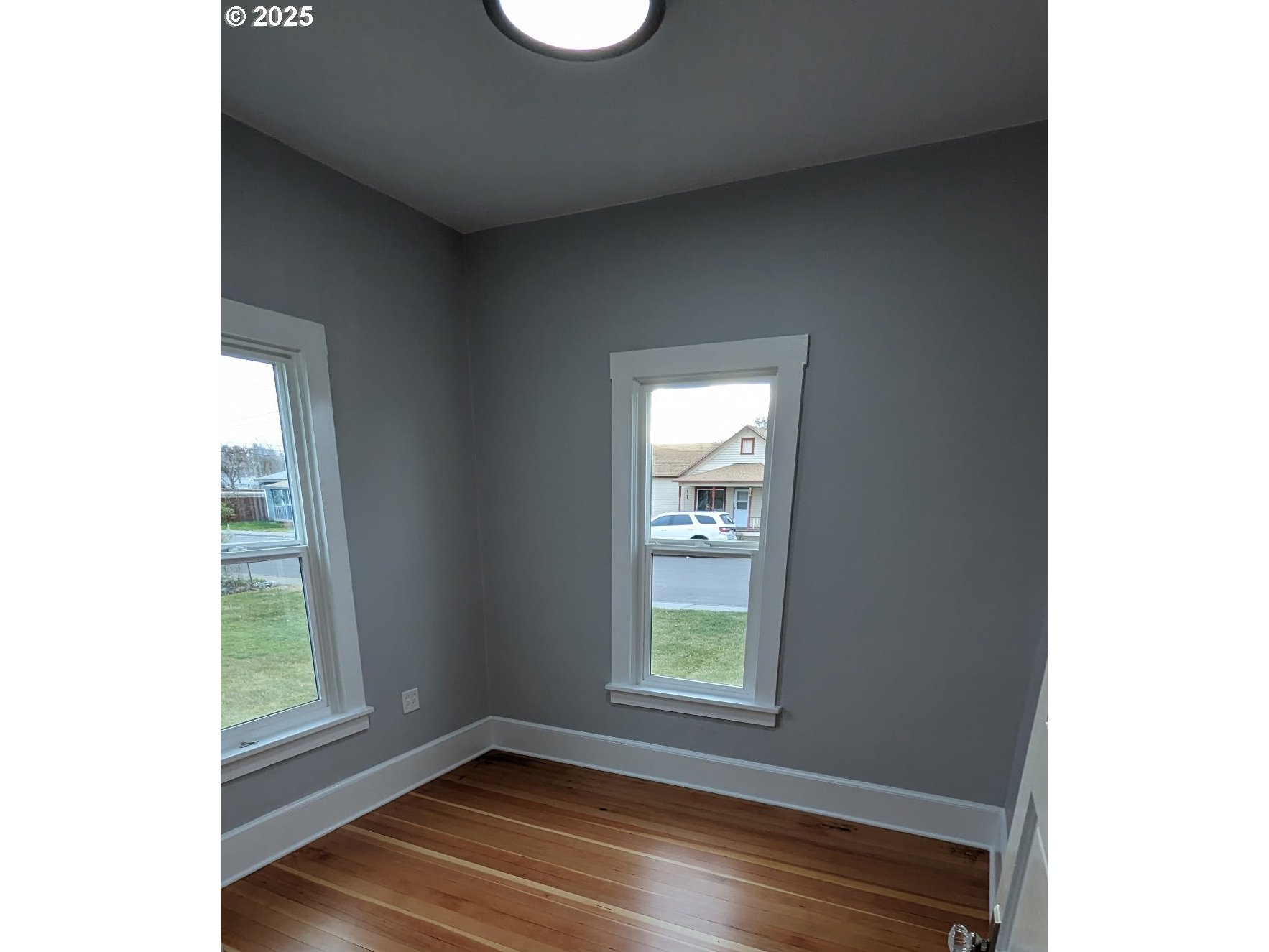 377 West Locust Avenue Hermiston, OR 97838 - Photo 14 of 16 a view of room with window and hardwood floor