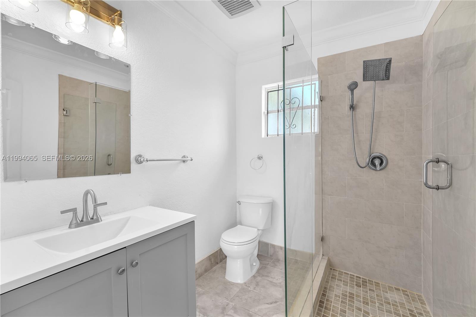 10960 Southwest 219th Street Miami, FL 33170 - Photo 14 of 22 a bathroom with a sink toilet and shower