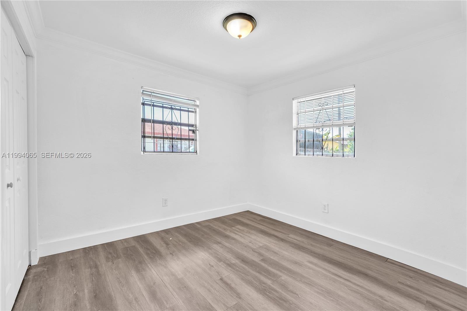 10960 Southwest 219th Street Miami, FL 33170 - Photo 16 of 22 an empty room with a window