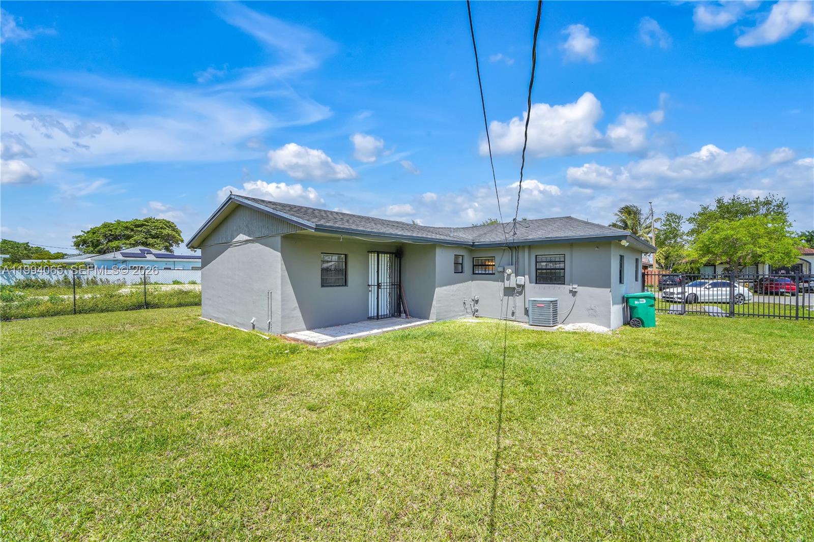 10960 Southwest 219th Street Miami, FL 33170 - Photo 20 of 22 a front view of house with yard and entertaining space