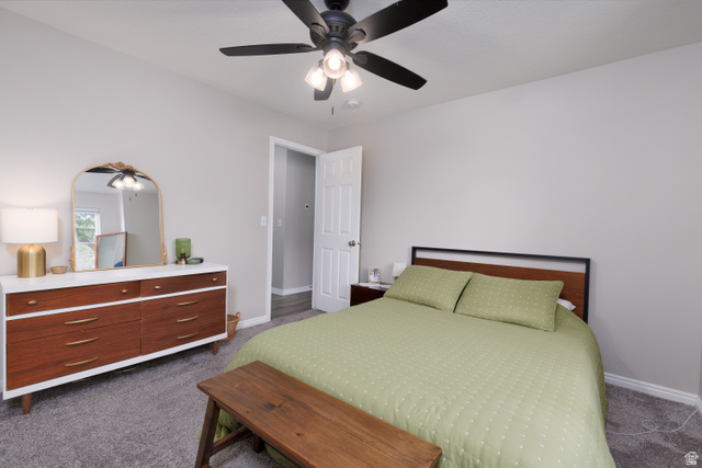 260 400 North, Unit 1 Orem, UT 84057 - Photo 8 of 17 Bedroom featuring dark carpet and a ceiling fan