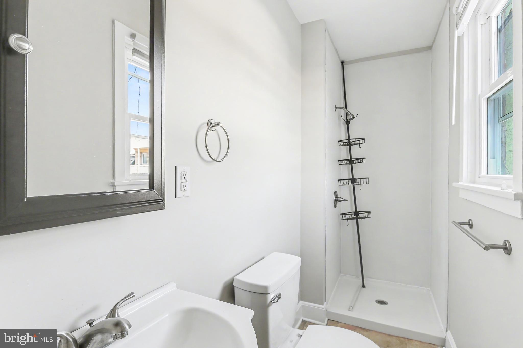 626 State Street, Unit 4 Lemoyne, PA 17043 - Photo 7 of 8 a bathroom with a shower toilet and sink