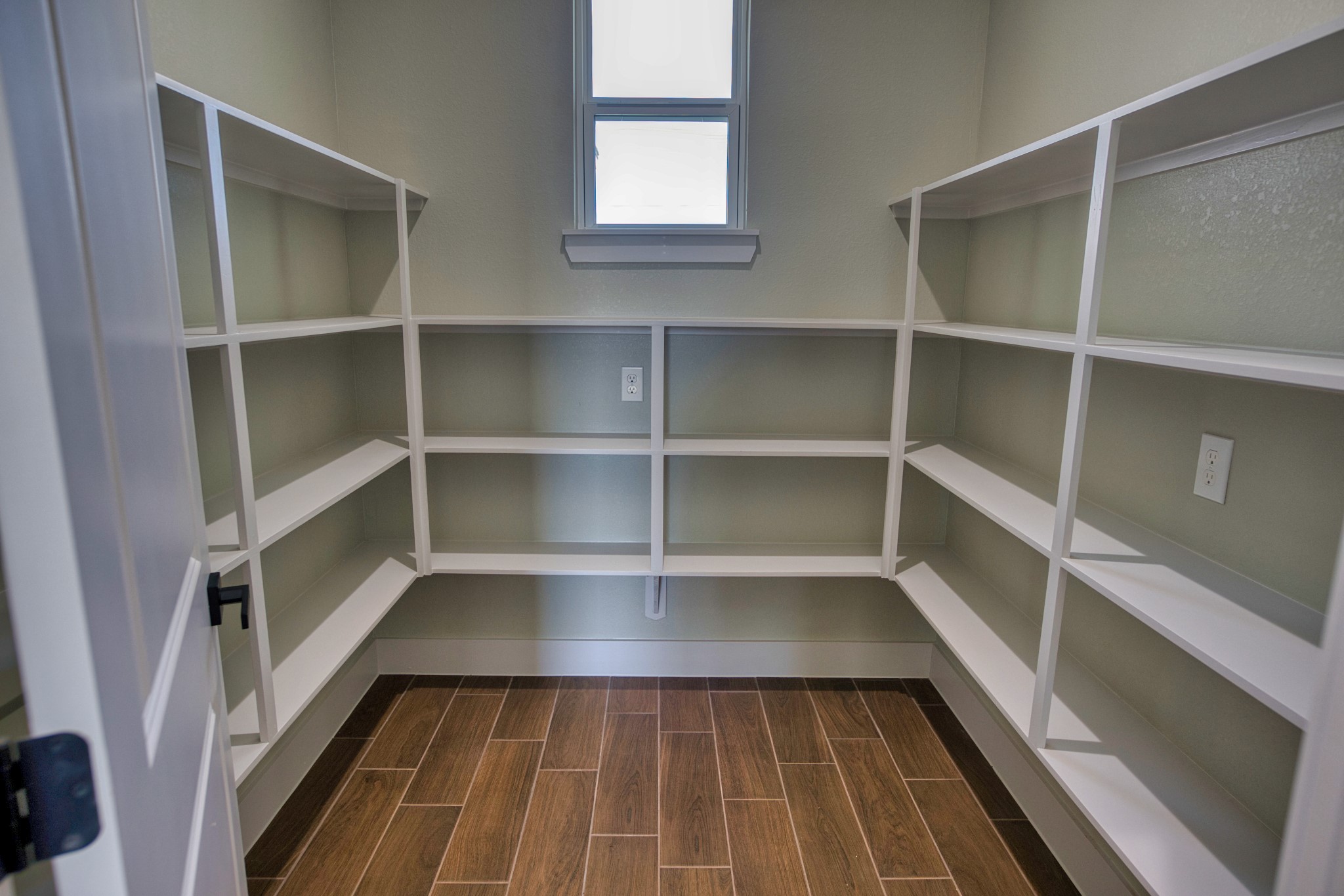 925 Buffalo Trail Angleton, TX 77515 - Photo 24 of 45 a view of a room with wooden floor and a window