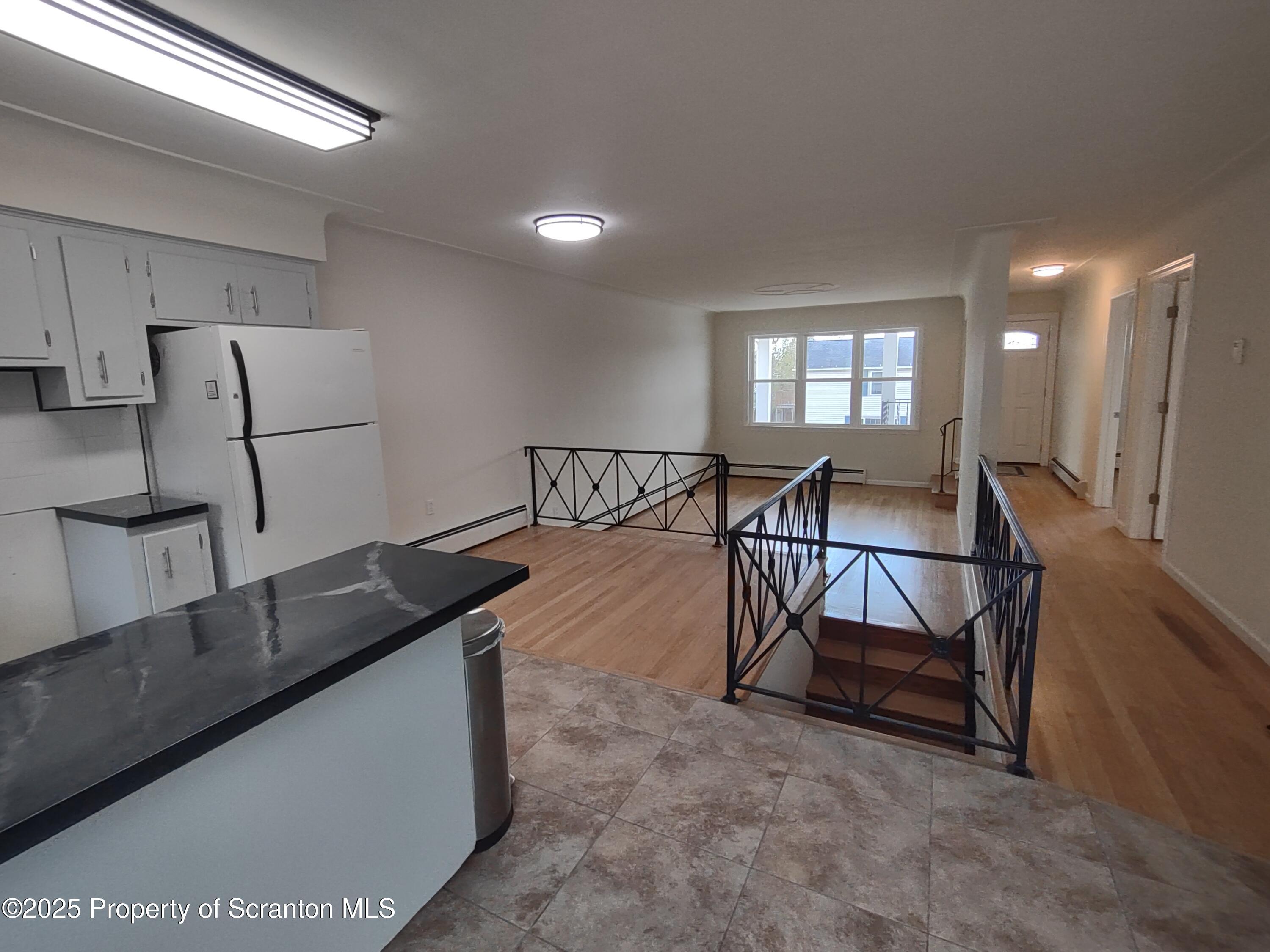1104 Filbert Street Archbald, PA 18403 - Photo 13 of 39 a living room with chairs and a table