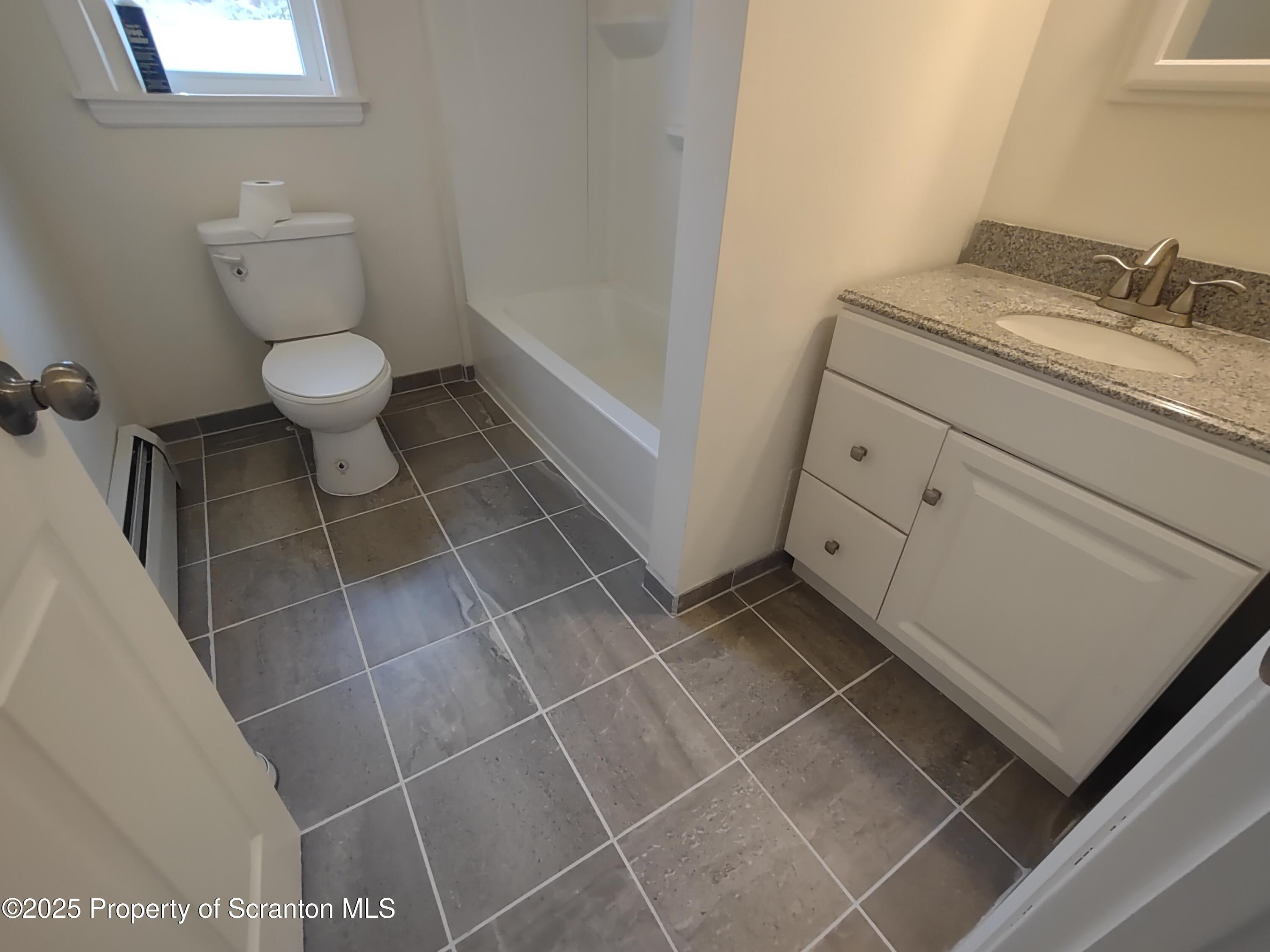1104 Filbert Street Archbald, PA 18403 - Photo 18 of 39 a bathroom with a toilet and a sink