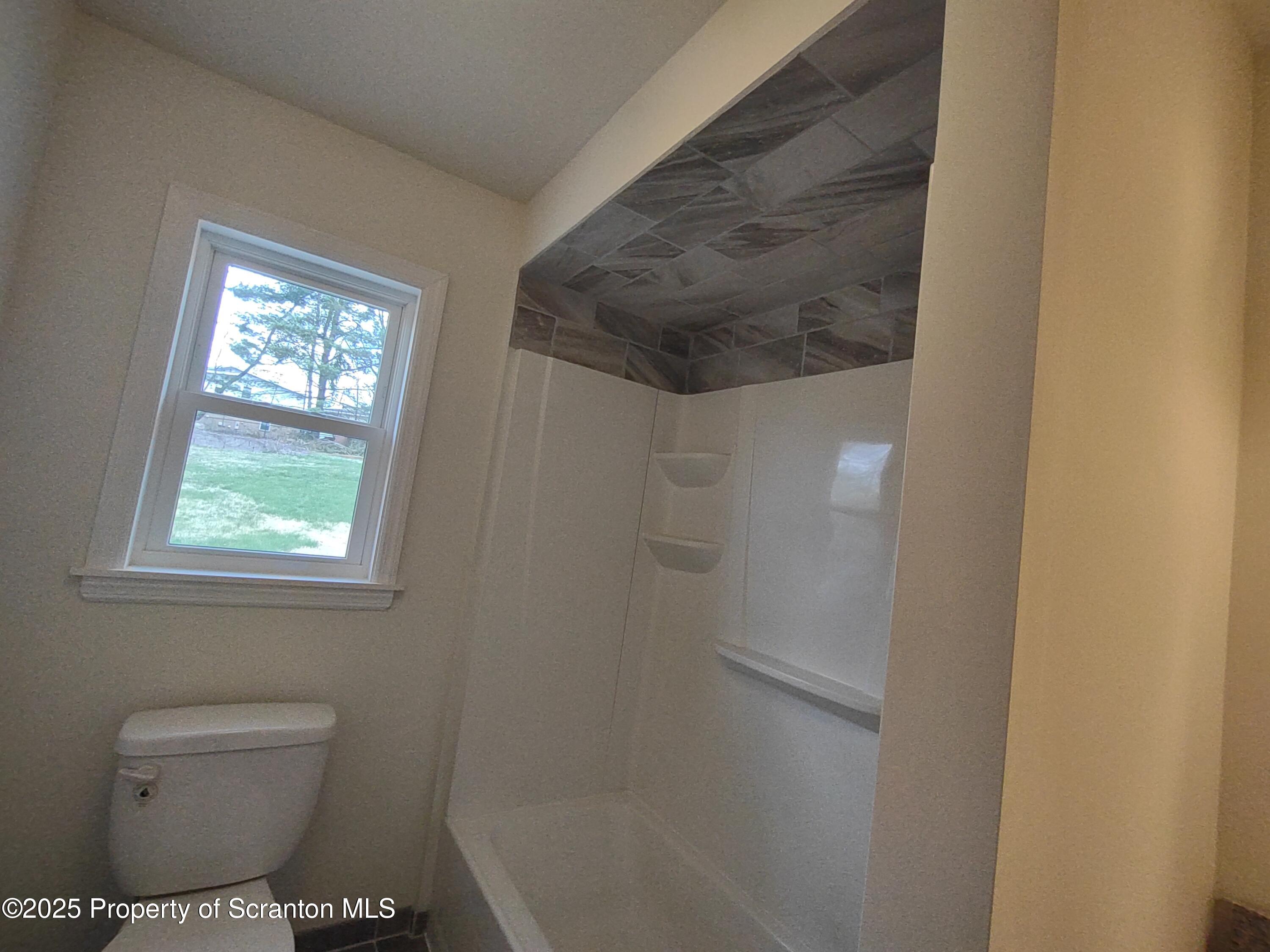 1104 Filbert Street Archbald, PA 18403 - Photo 22 of 39 a bathroom with a toilet and a shower