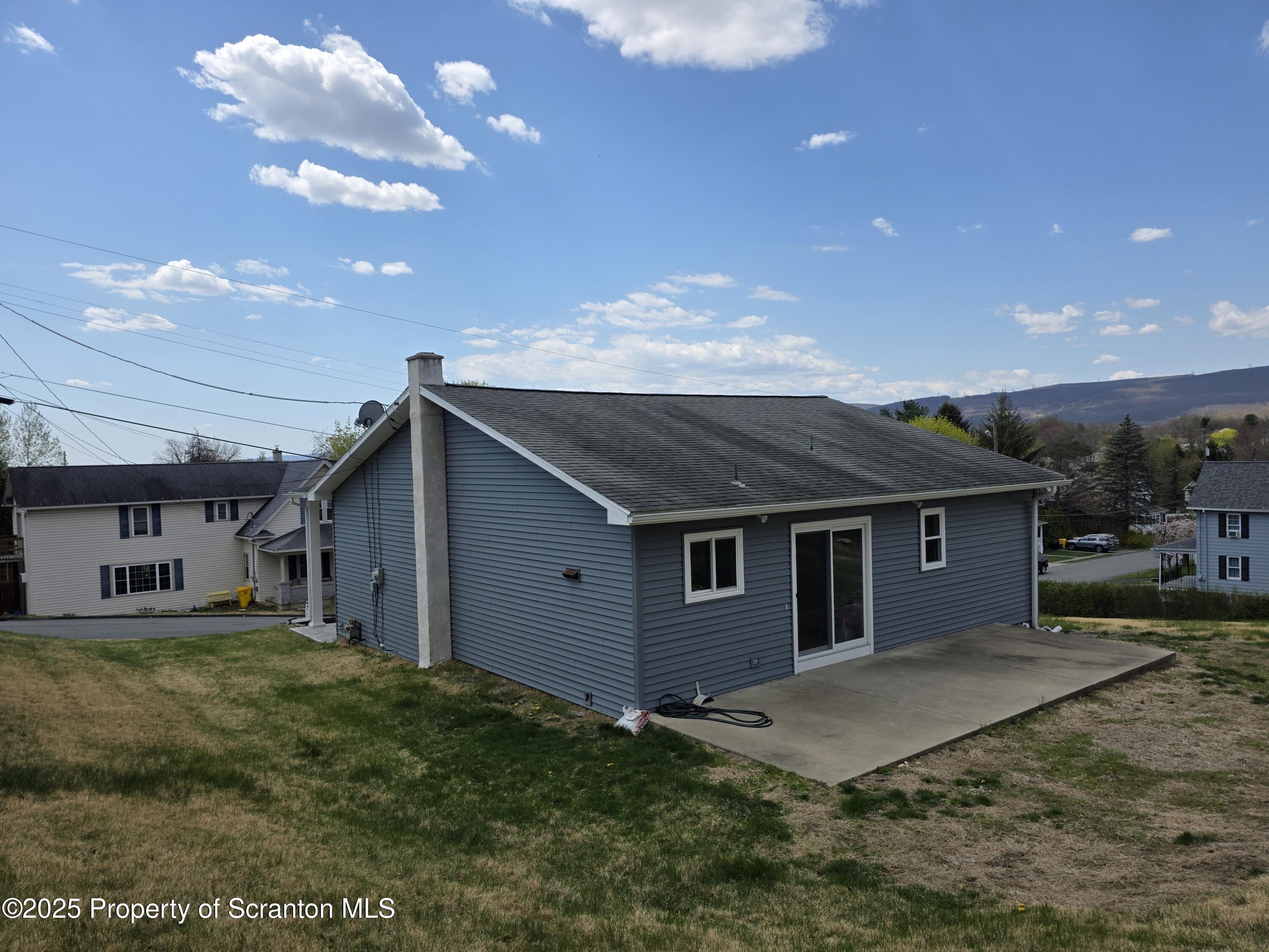 1104 Filbert Street Archbald, PA 18403 - Photo 29 of 39 a backyard of a house with table and chairs