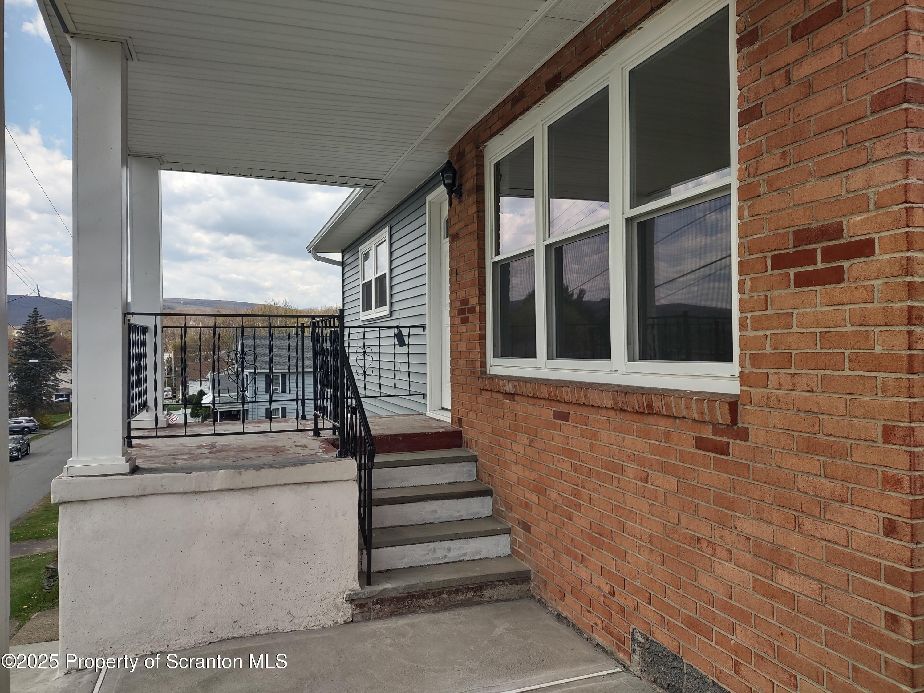 1104 Filbert Street Archbald, PA 18403 - Photo 3 of 39 a view of front door of house with stairs