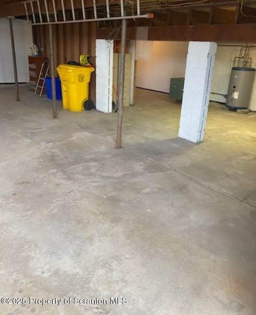 1104 Filbert Street Archbald, PA 18403 - Photo 33 of 39 a view of an empty room with wooden floor and a sink