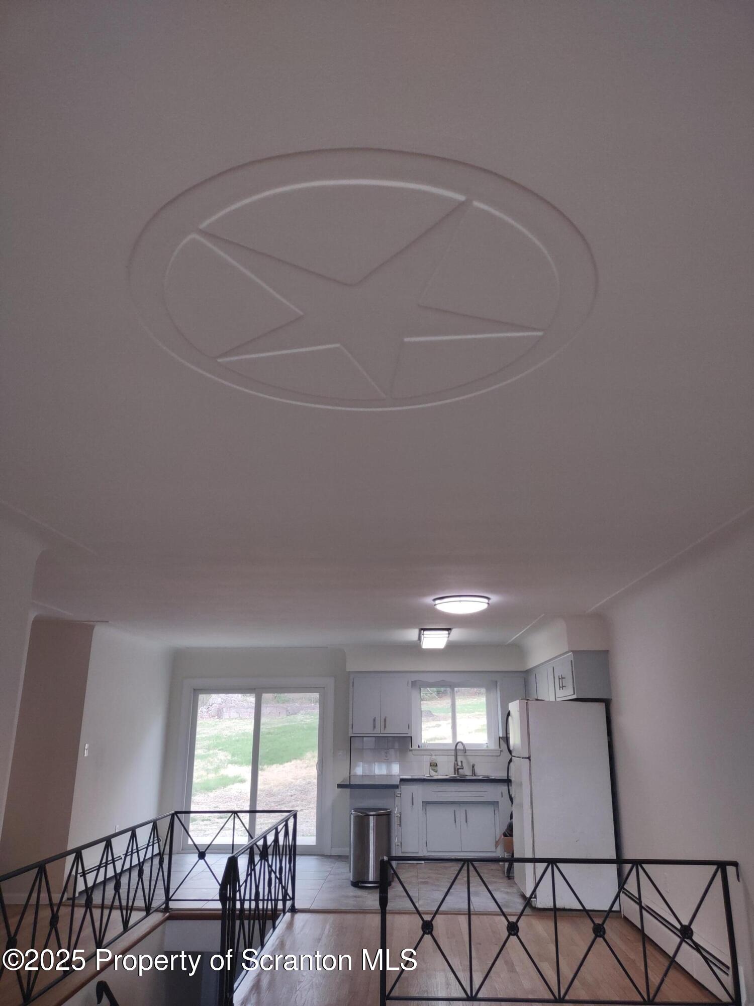 1104 Filbert Street Archbald, PA 18403 - Photo 6 of 39 a room with lots of windows and plants