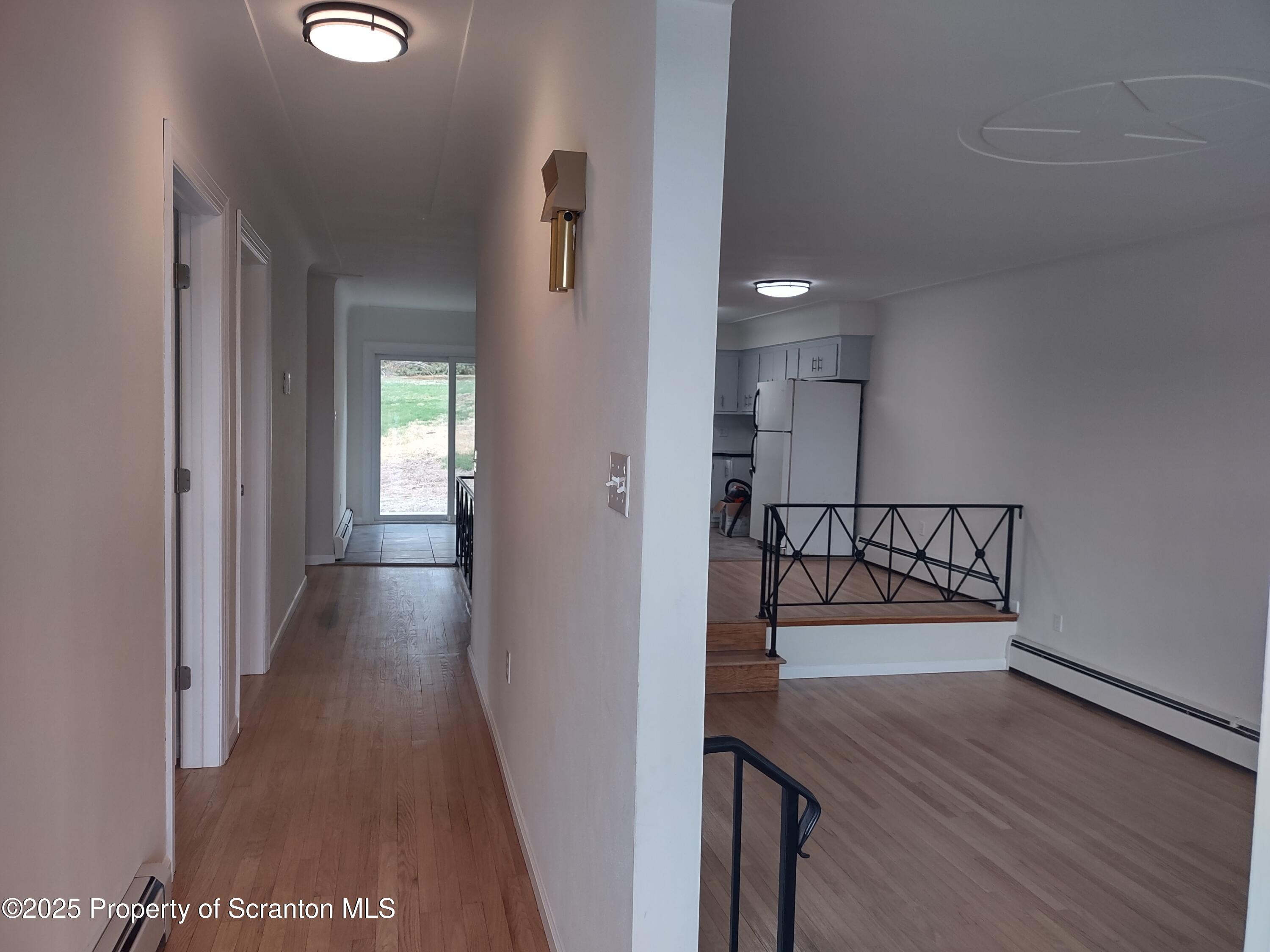 1104 Filbert Street Archbald, PA 18403 - Photo 10 of 39 a view of a hallway with wooden floor