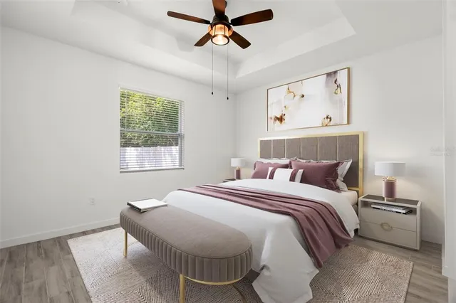 a bedroom with a bed and window