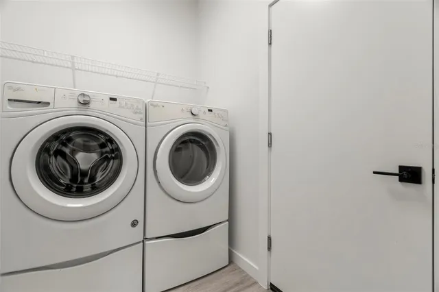 a utility room with dryer and washer