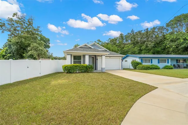 front view of a house with a yard