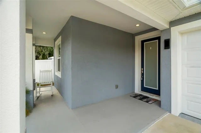 a view of an empty room and a bathroom