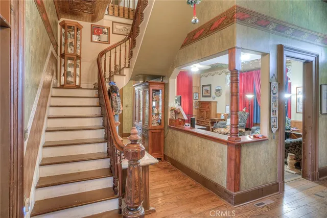 a bedroom with a bed and a table chair