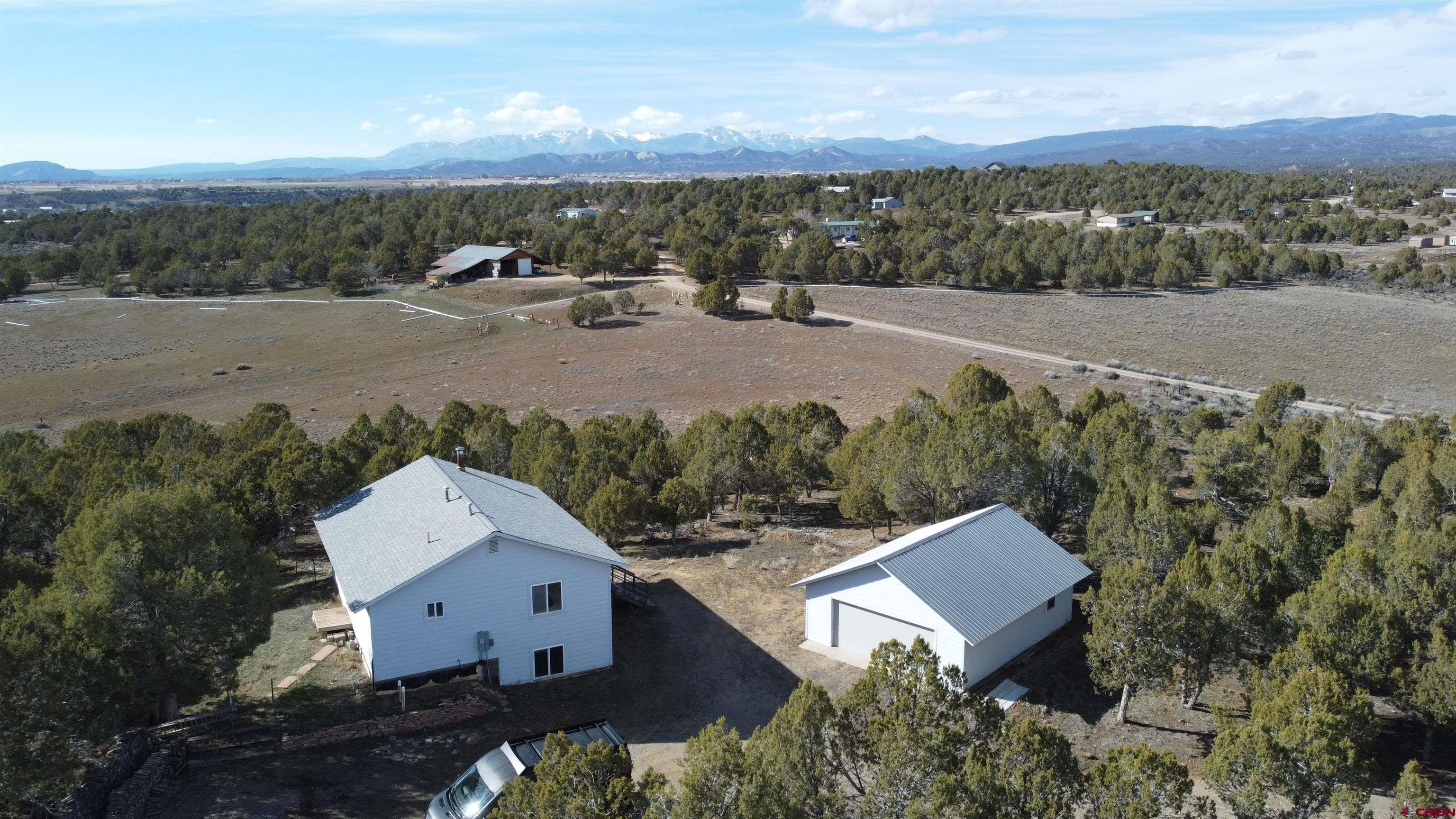2944 County Road 510 Durango, CO 81303 - Photo 1 of 38 an aerial view of a house with a yard