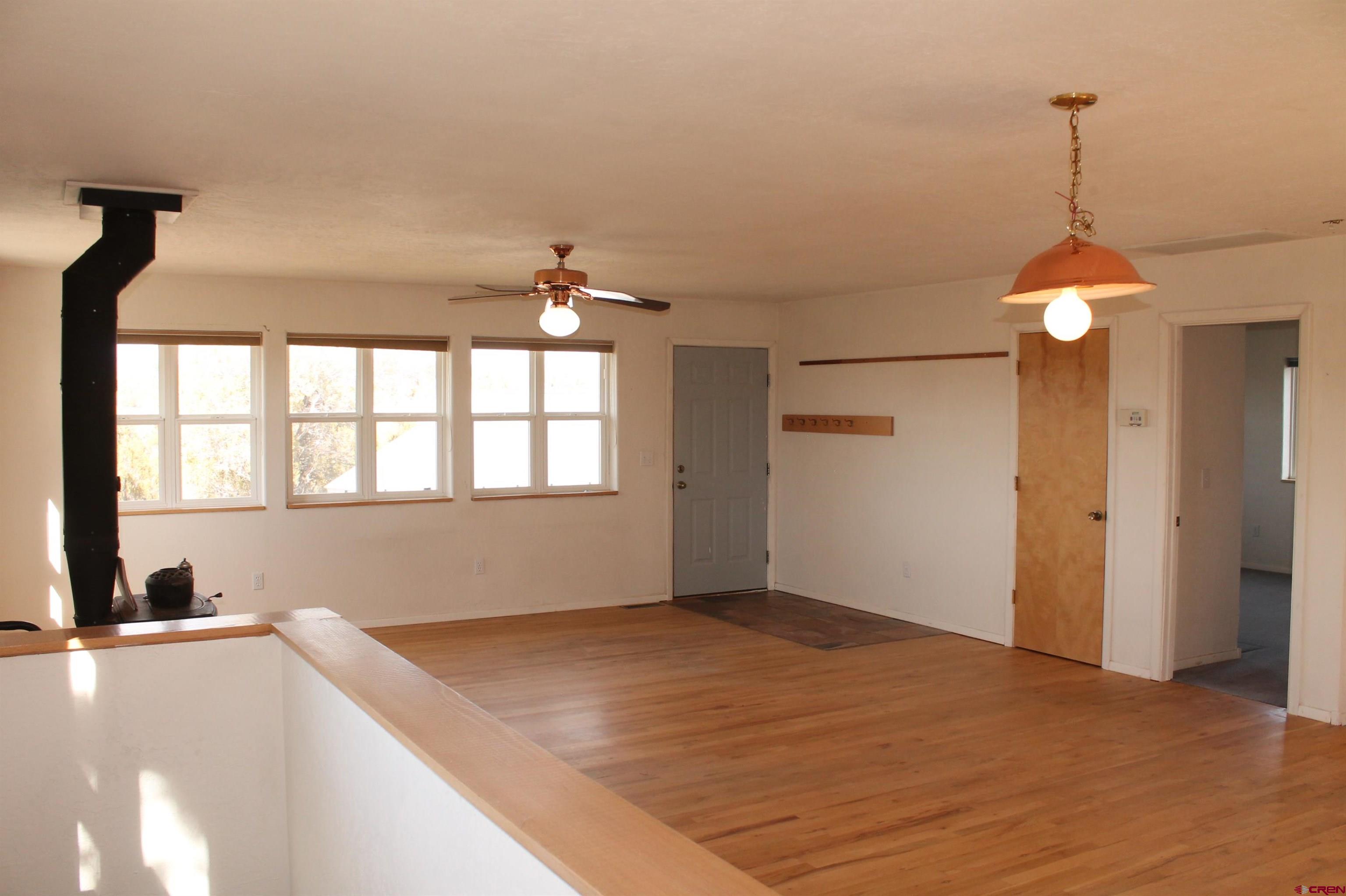 2944 County Road 510 Durango, CO 81303 - Photo 14 of 38 a view of an empty room with window and wooden floor