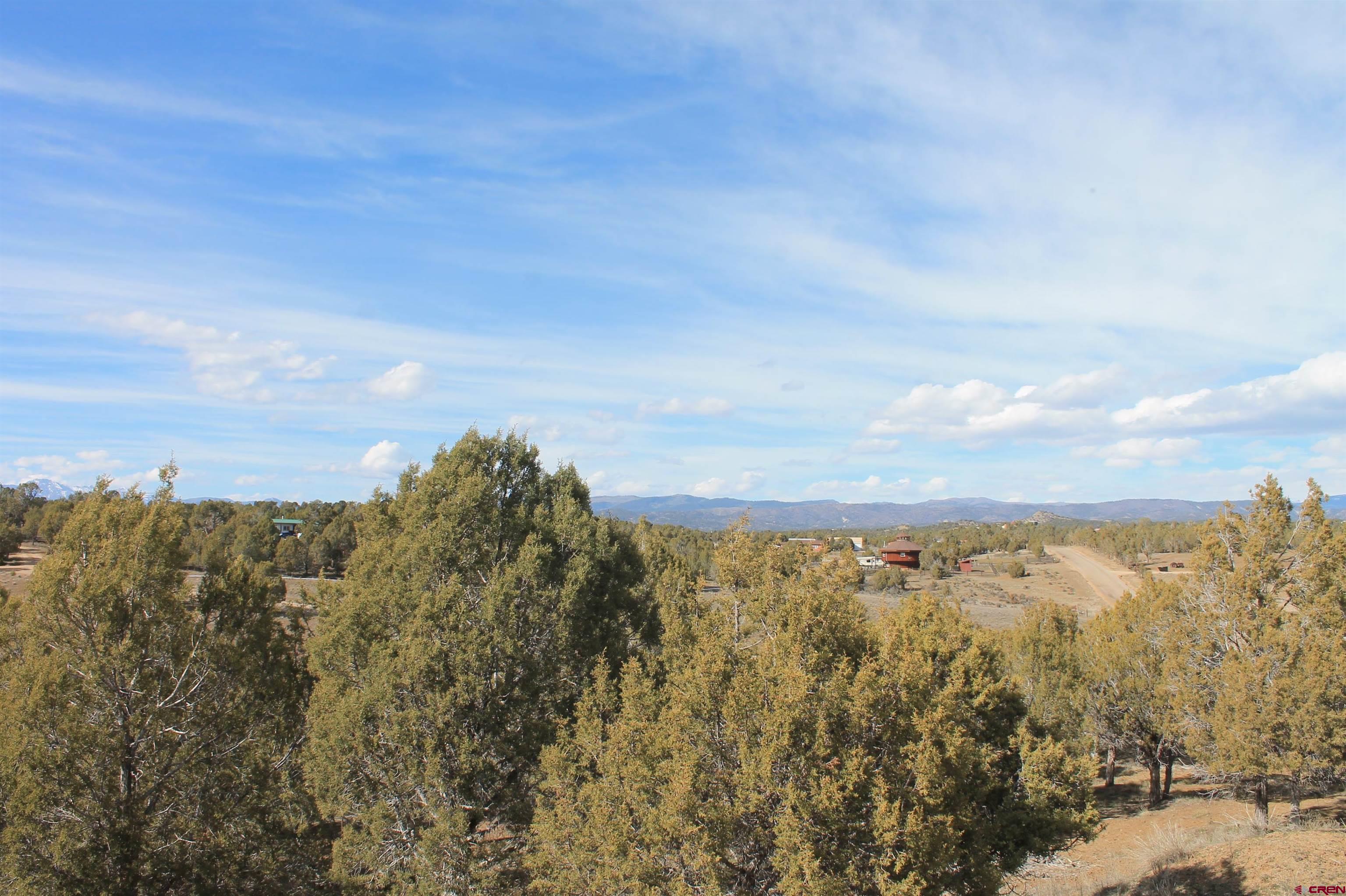 2944 County Road 510 Durango, CO 81303 - Photo 34 of 38 a view of a large building with mountains in the background