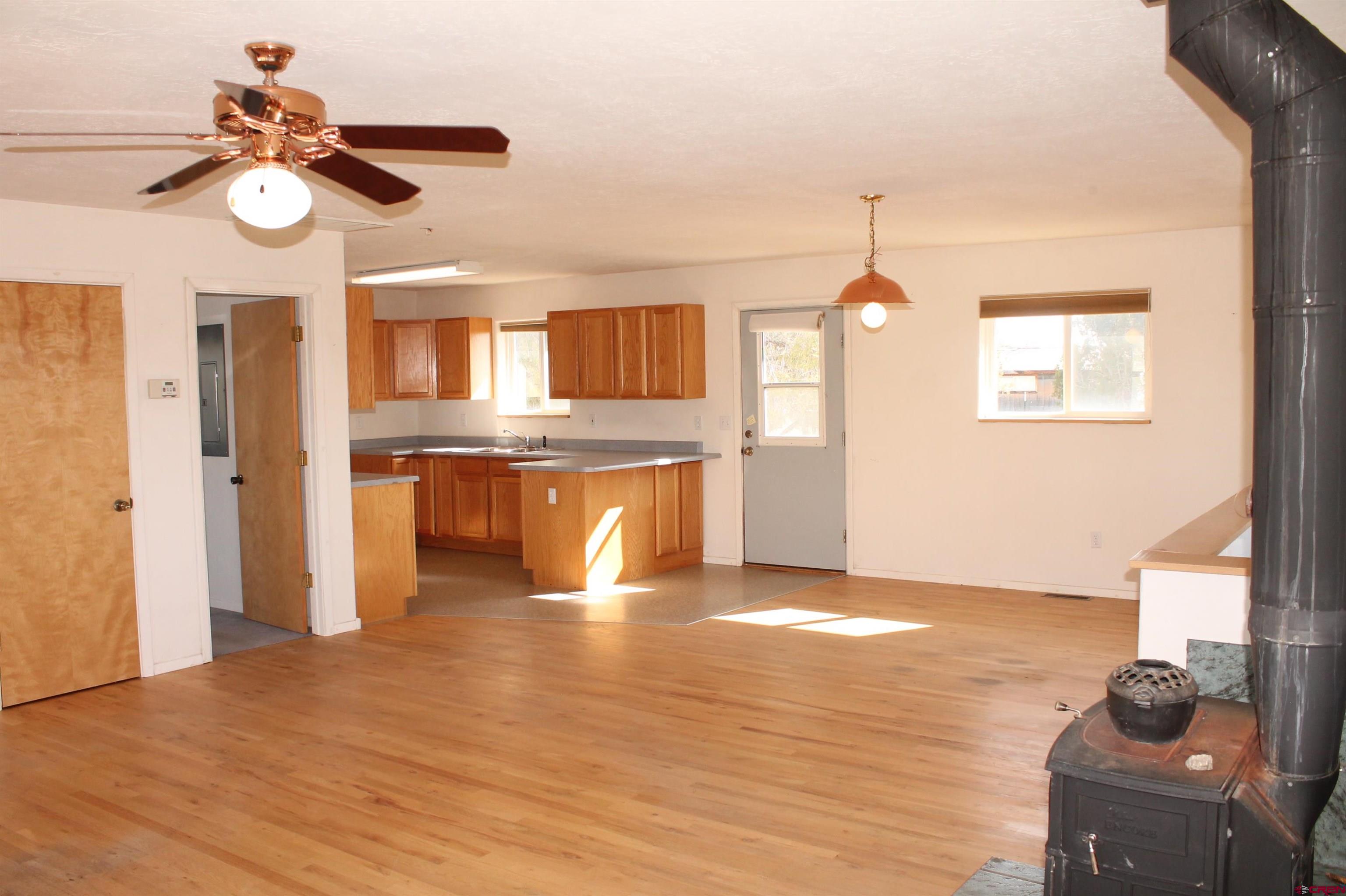 2944 County Road 510 Durango, CO 81303 - Photo 8 of 38 a view of a kitchen with wooden floor and stainless steel appliances