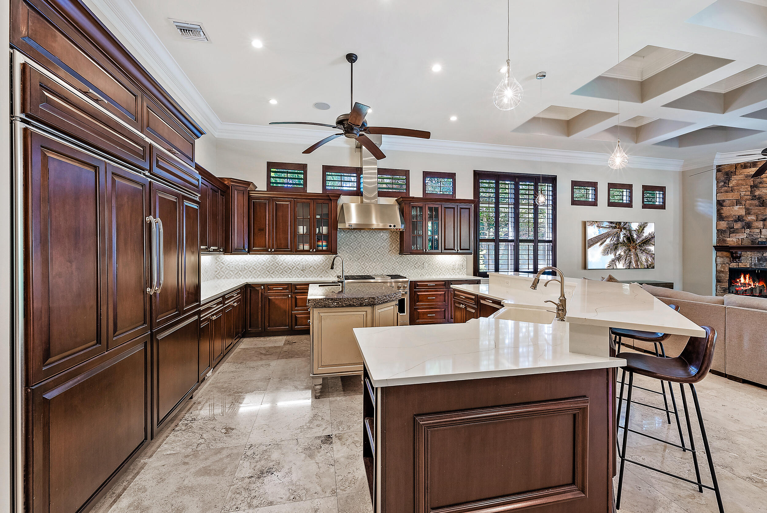 5745 Pennock Point Road Jupiter, FL 33458 - Photo 12 of 31 a kitchen with a stove a refrigerator and a dining table