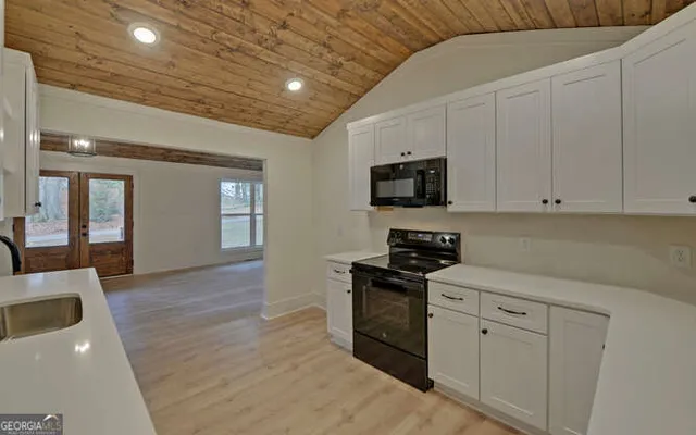 a kitchen with sink and cabinets