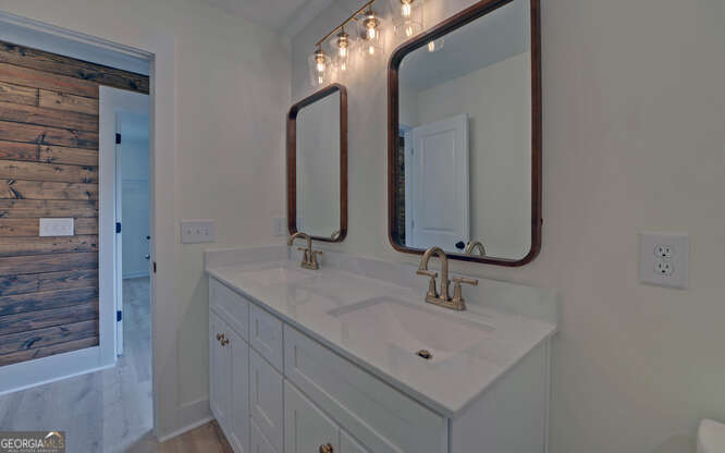 999 East Doyle Street Toccoa, GA 30577 - Photo 21 of 42 a bathroom with a sink and a mirror