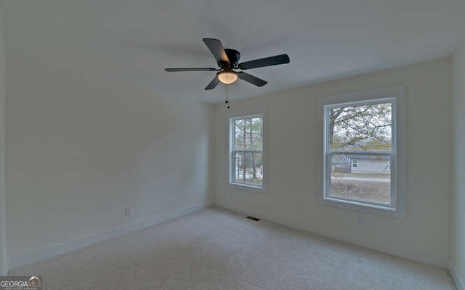 999 East Doyle Street Toccoa, GA 30577 - Photo 22 of 42 a view of workspace with window and ceiling fan