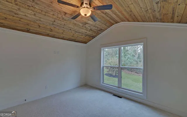 a bathroom with a shower and a toilet