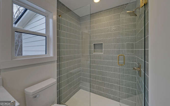 999 East Doyle Street Toccoa, GA 30577 - Photo 32 of 42 a bathroom with a shower and a toilet