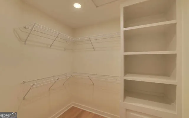 a view of deck with hardwood and trees