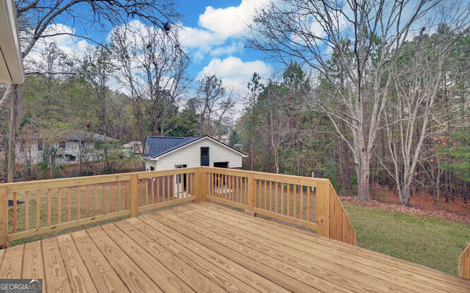 999 East Doyle Street Toccoa, GA 30577 - Photo 34 of 42 a view of deck with wooden floor and fence