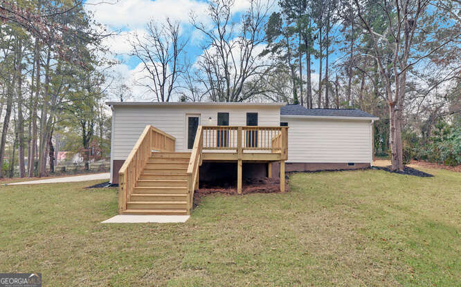 999 East Doyle Street Toccoa, GA 30577 - Photo 42 of 42 a view of a house with a yard and garage