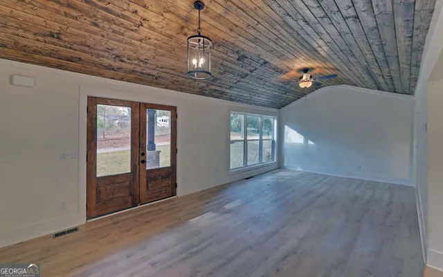 en empty room with windows