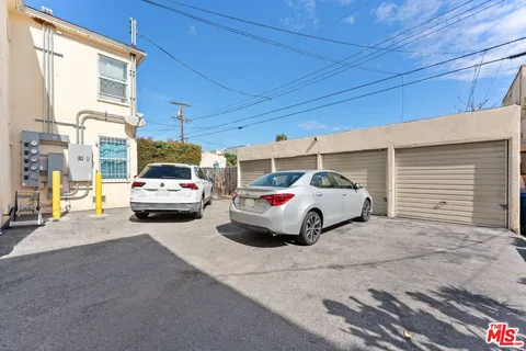 a view of cars parked in front of a house