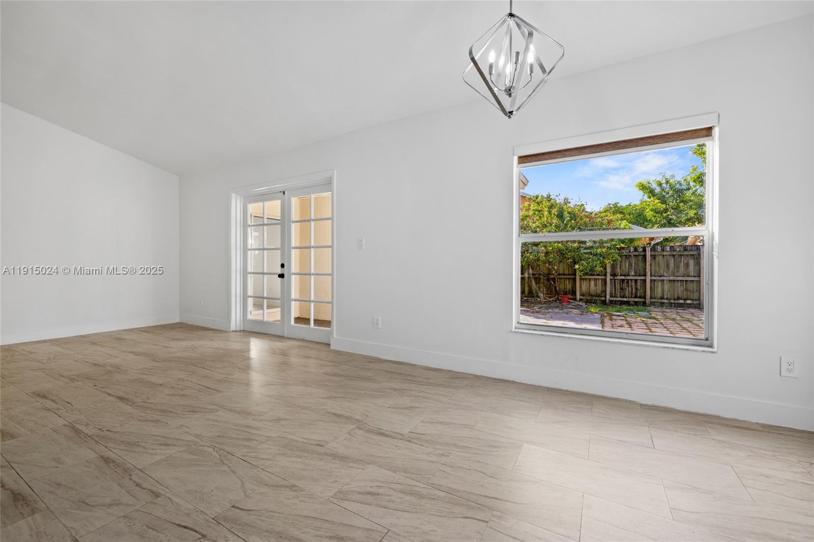 12740 Southwest 249th Terrace Homestead, FL 33032 - Photo 13 of 27 a view of an empty room with a window