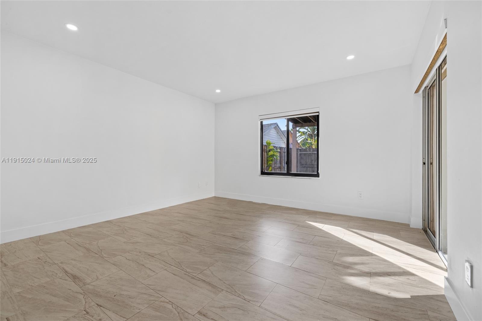12740 Southwest 249th Terrace Homestead, FL 33032 - Photo 14 of 27 an empty room with windows and closet