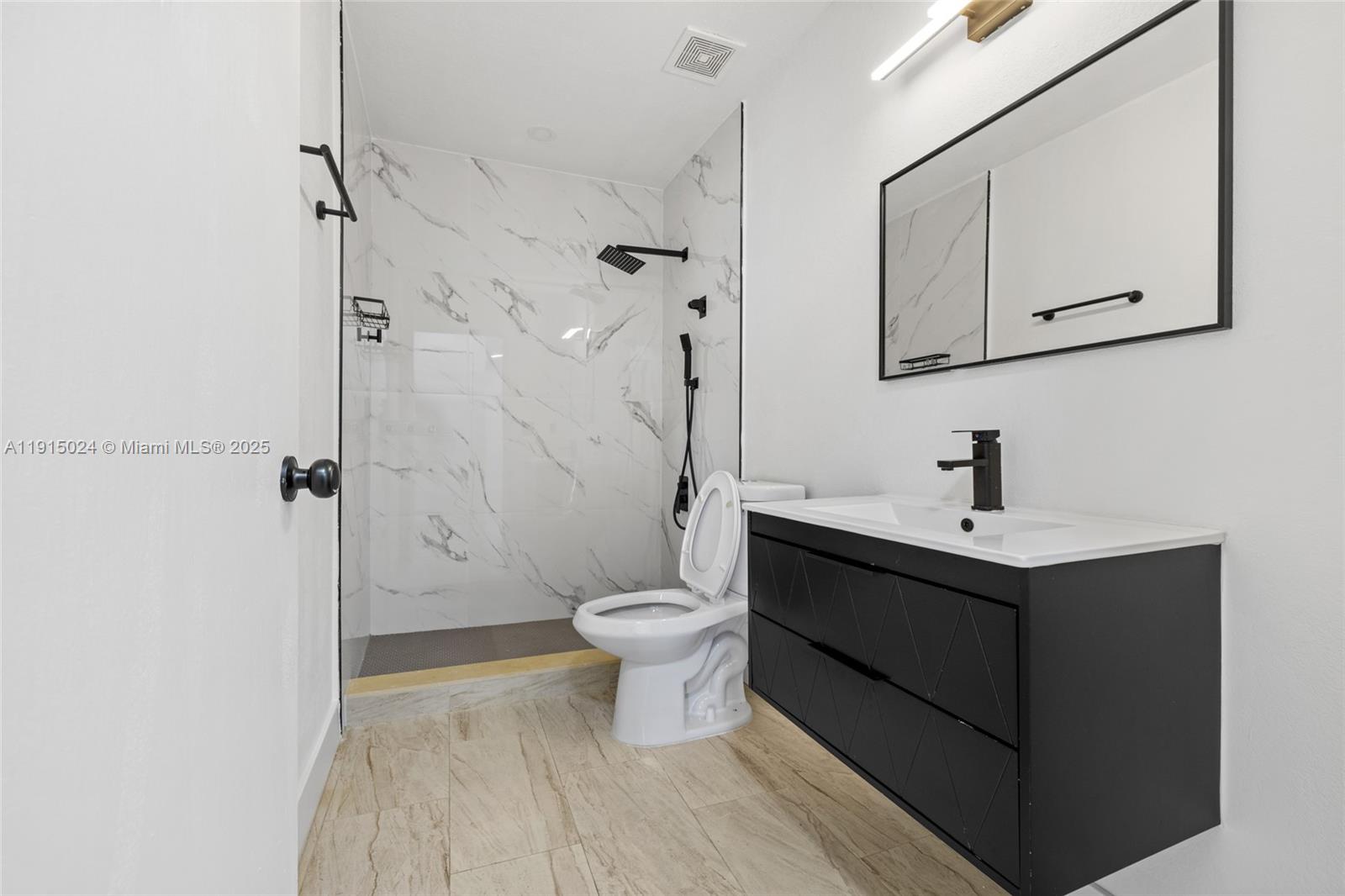 12740 Southwest 249th Terrace Homestead, FL 33032 - Photo 17 of 27 a bathroom with a sink toilet and shower