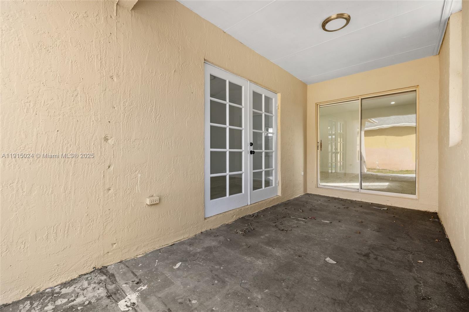 12740 Southwest 249th Terrace Homestead, FL 33032 - Photo 19 of 27 a view of an empty room with a window