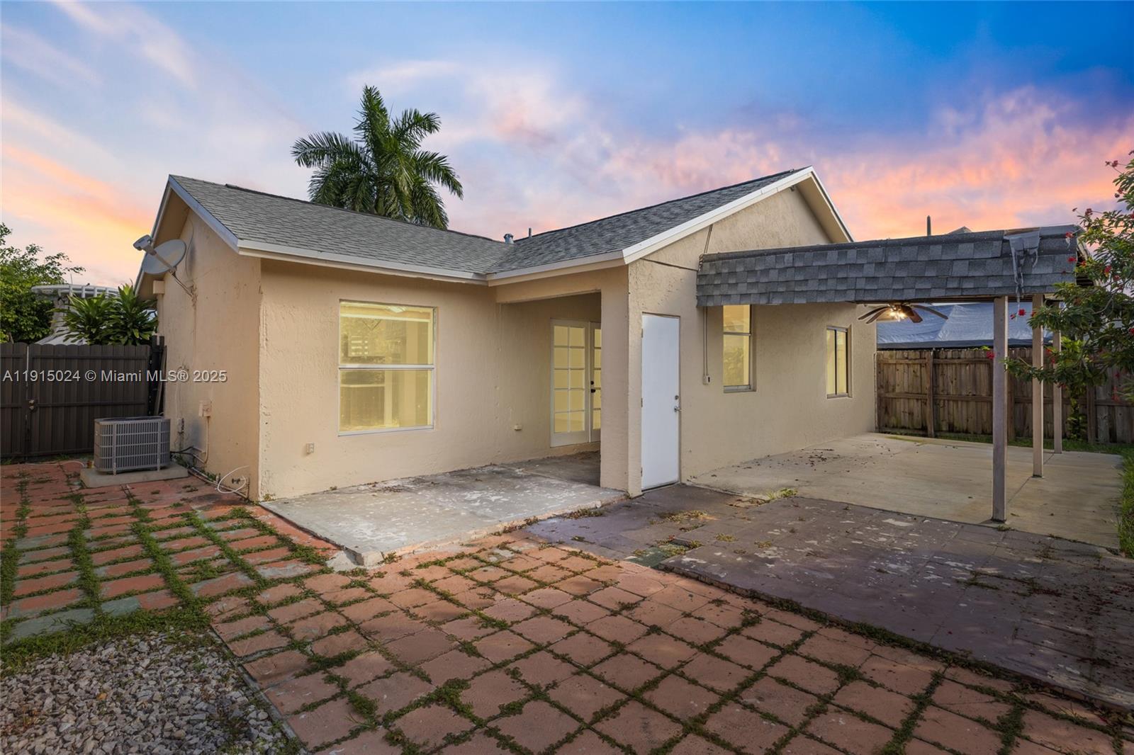 12740 Southwest 249th Terrace Homestead, FL 33032 - Photo 20 of 27 a front view of a house with a yard