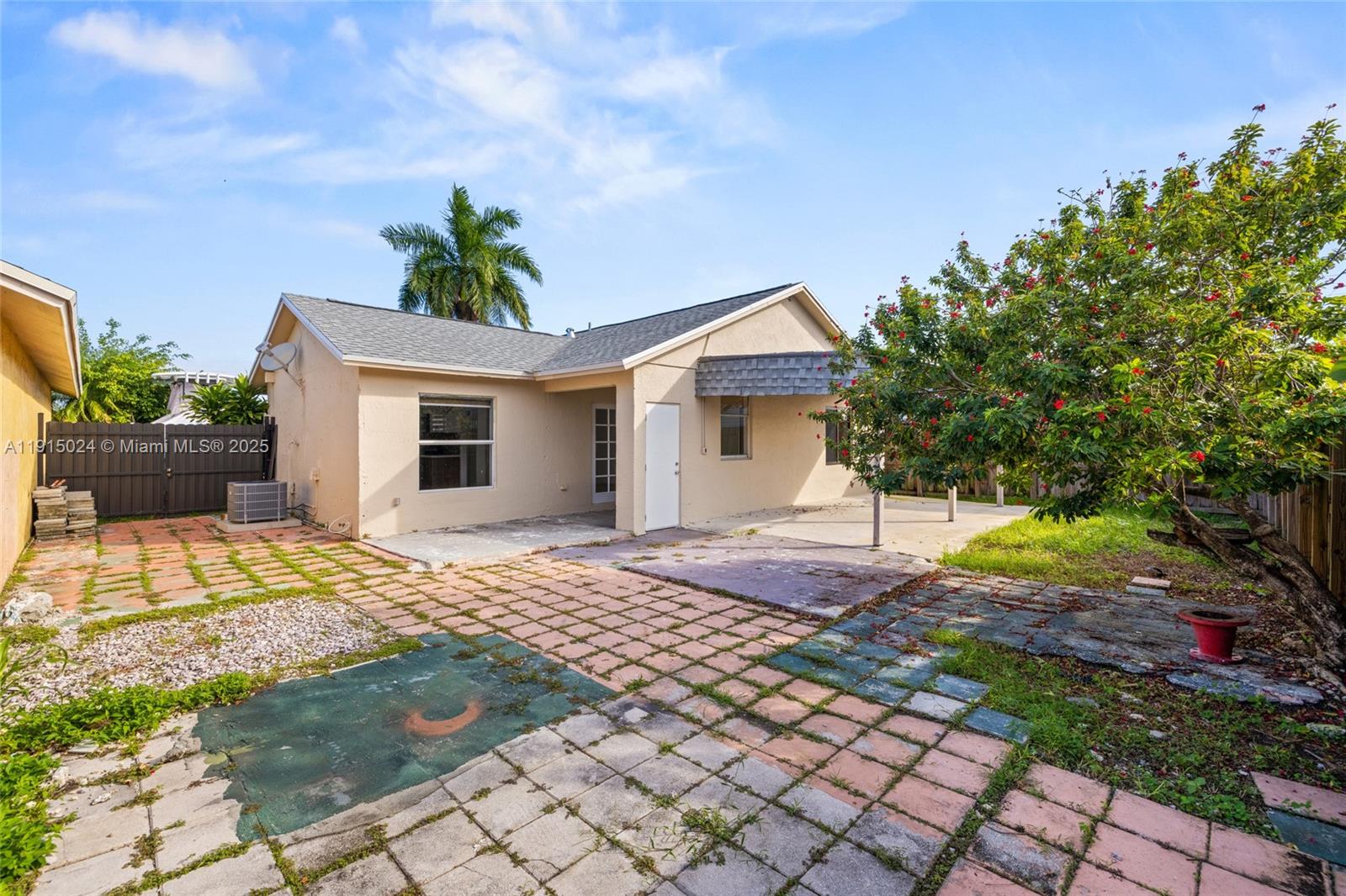12740 Southwest 249th Terrace Homestead, FL 33032 - Photo 21 of 27 a front view of a house with a yard