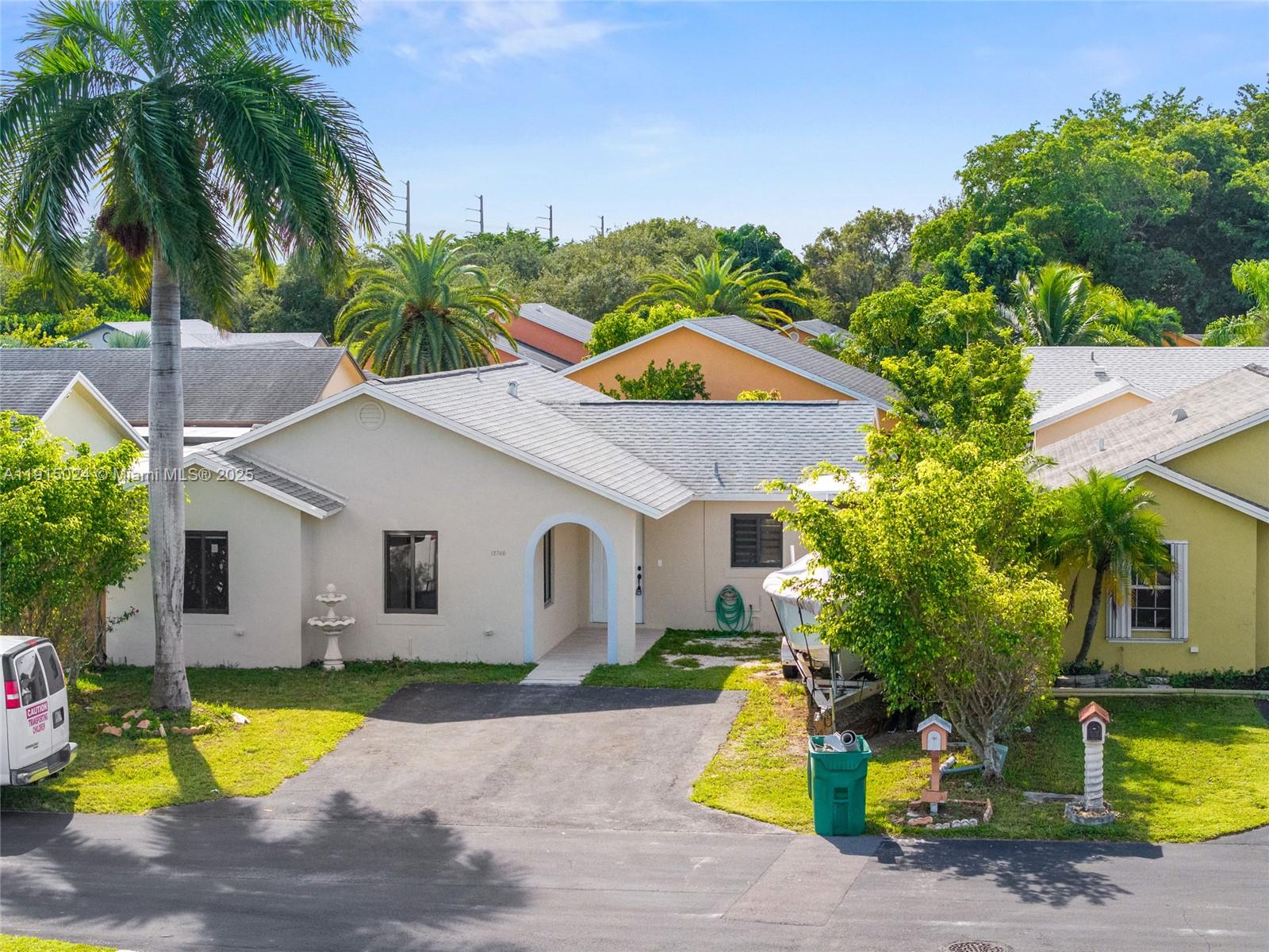 12740 Southwest 249th Terrace Homestead, FL 33032 - Photo 27 of 27 a front view of house with yard and swimming pool