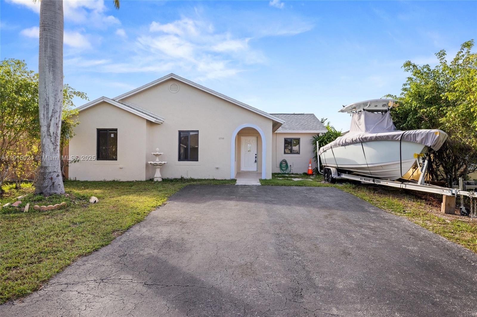 12740 Southwest 249th Terrace Homestead, FL 33032 - Photo 5 of 27 a view of a house with backyard