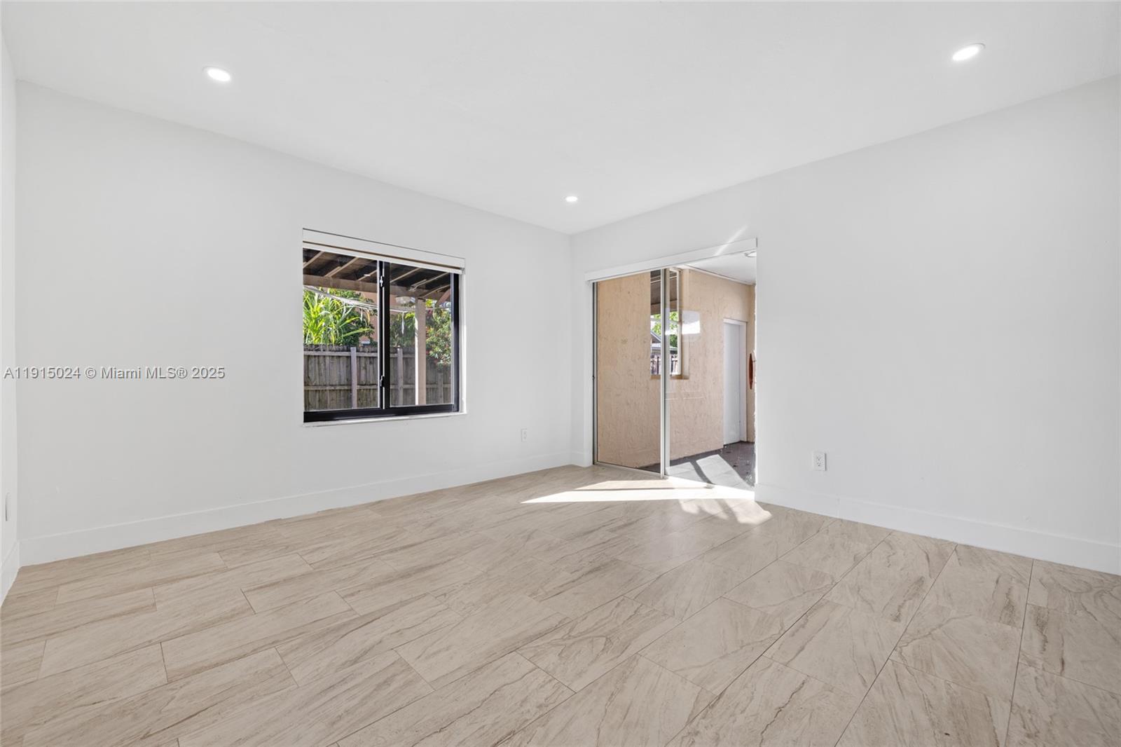 12740 Southwest 249th Terrace Homestead, FL 33032 - Photo 6 of 27 an empty room with windows and closet
