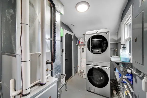 a view of a storage and utility room with a washer dryer